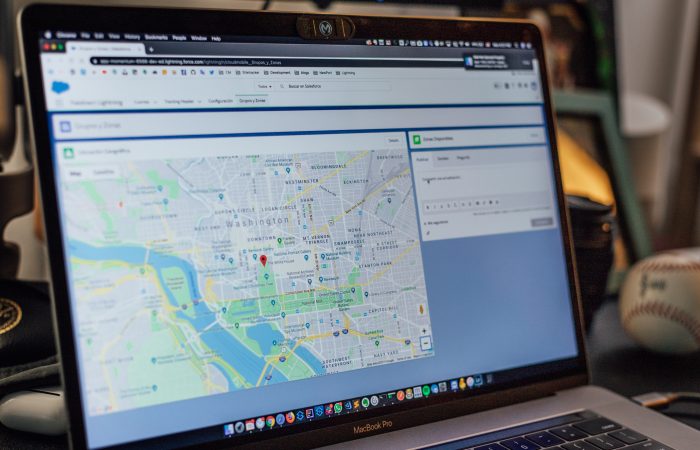 Map application on a laptop screen.